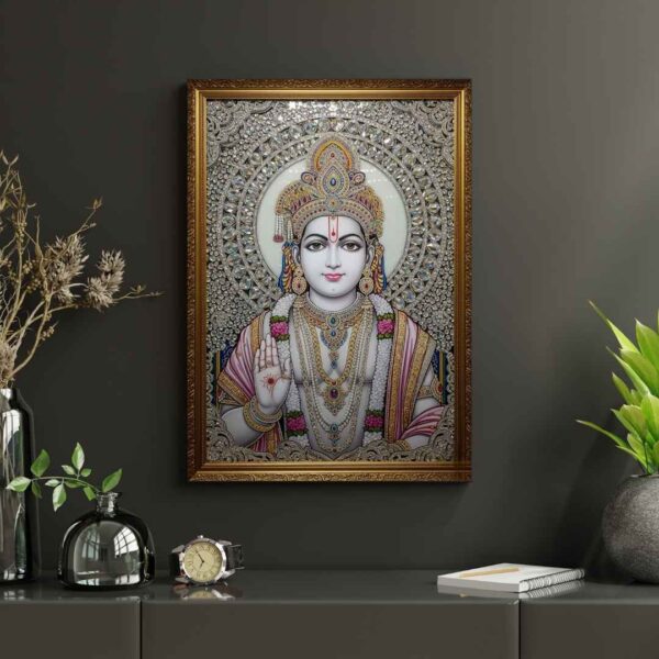 Invite the auspicious presence of Lord Rama into your home with this exquisite, jewel-embellished artwork. Portrayed with a calm and compassionate demeanor, Lord Rama's divine form is adorned with a resplendent crown, intricate necklaces, and garlands of flowers, all brought to life with shimmering crystals and detailed artistry. His right hand is raised in the Abhaya Mudra, offering reassurance and dispelling fears. The radiant halo behind him signifies his divine light and purity. This sacred piece is ideal for your puja room, meditation space, or living area, serving as a constant source of inspiration, peace, and protection for your family.